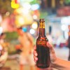 Hand Holds Beer In Street Shutterstock